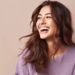 Dermal Filler Treatments A person laughing with a natural, youthful appearance, highlighting the restored volume and confidence provided by dermal fillers.